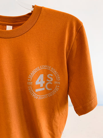 Pictured is our Autumn colored 100% cotton T-shirt with our new 4 Seasons circle logo. Specialty coffee roasted since 1976