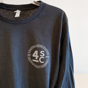 Picture is our new 4 Seasons Coffee Roasters circle logo in the top left corner. Small size and in white. 100% Cotton.